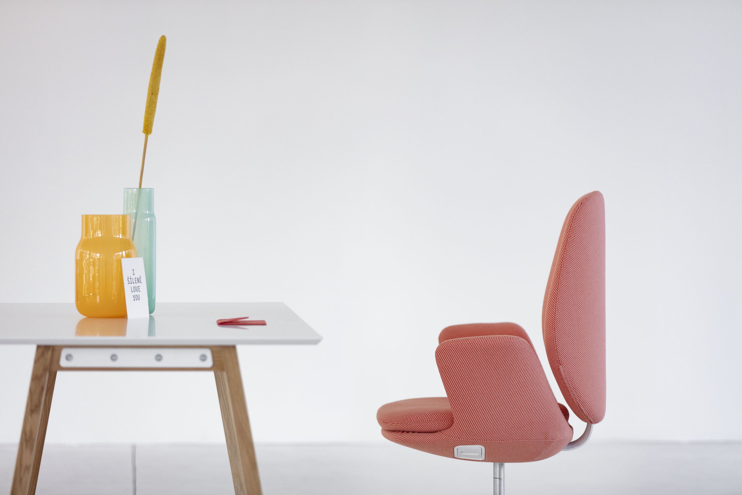 Modern office space with desks and chair.