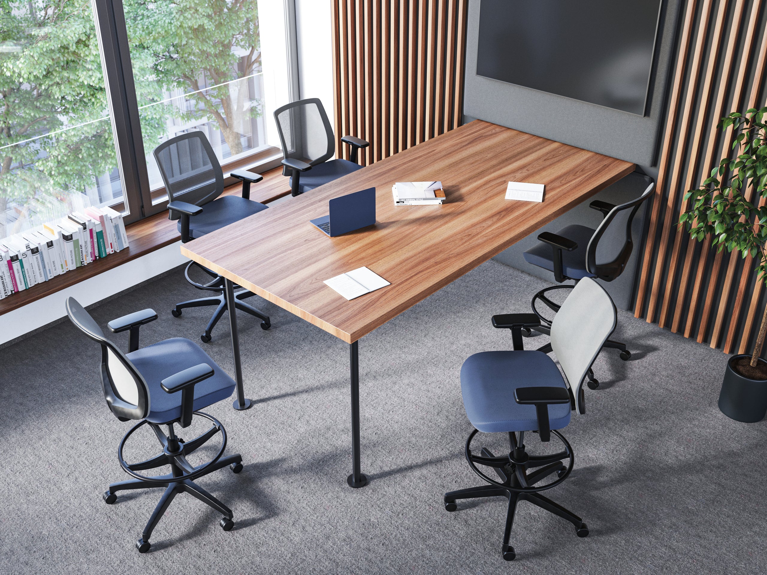 Modern office space with desk, blue rolling chairs, and vertical slat wood wall.