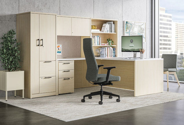 Modern office setup with a desk, chair, and storage cabinets.